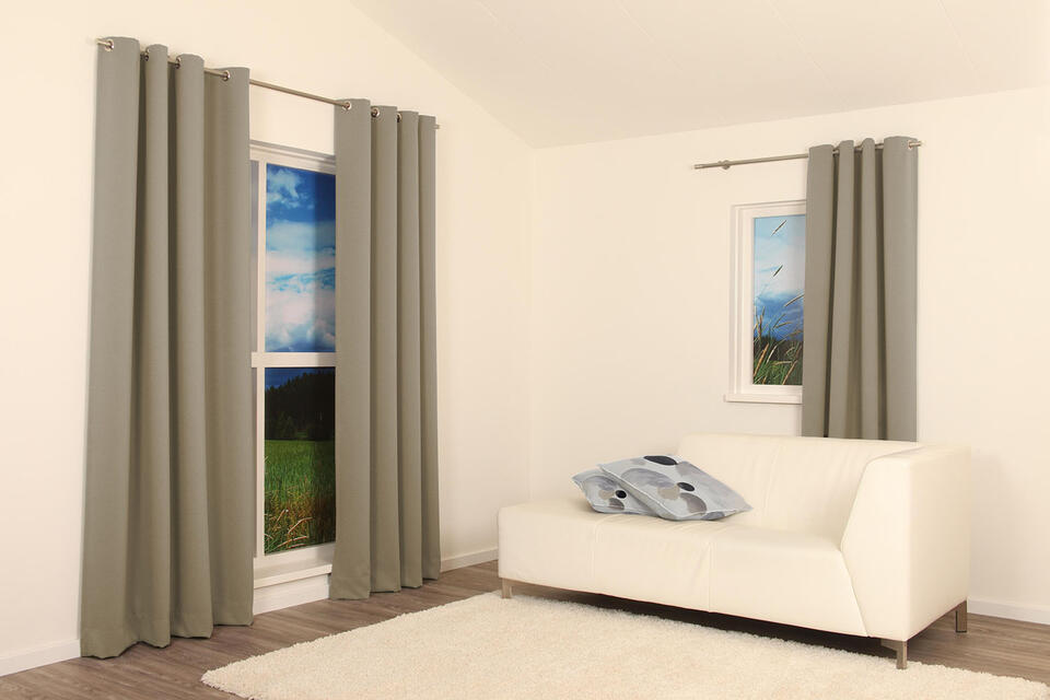 Verduisterende overgordijnstof met een mooie weefstructuur aan de voorzijde. De gladde achterzijde van de stof is effen naturel