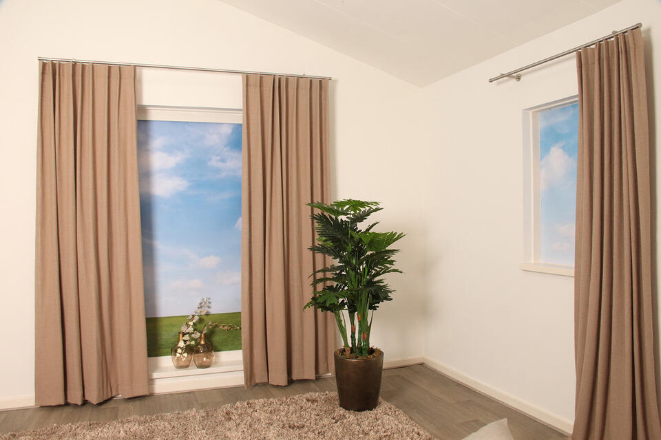 Met overgordijn Oppagne, die een subtiele bouclé effect heeft, creëer je een warme sfeer in huis